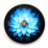 Glascabochon Blå blomma på svart botten 25mm